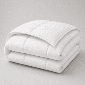 A folded white eiderdown comforter with the quilted corner turned back