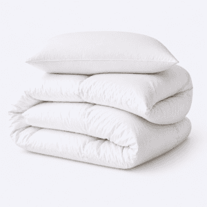 A folded white eiderdown comforter with a matching pillow resting on top
