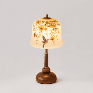 A table lamp with a hand-painted glass shade of flowers and a hummingbird on a turned wooden base