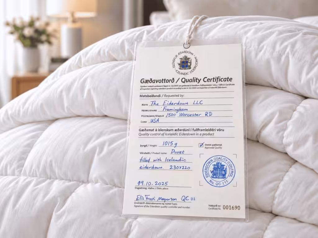 Icelandic Eiderdown quality certificate tag on a white eiderdown duvet, issued to The Eiderdown LLC, certificate number 001690
